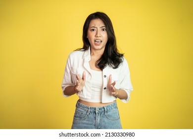 Asian Woman Feeling Shocked And Suprised Over Isolated Background