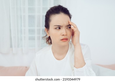 Asian Woman Feeling Unwell And Sneeze On Bed