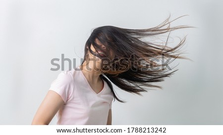 Asian woman Flick her hair fun