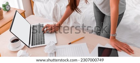 Asian woman freelancer upset with work problem with laptop on mess table.work at home concept.stress working