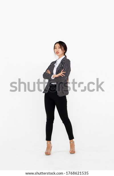Asian woman full body portrait on white\
background wearing formal business suit\
.