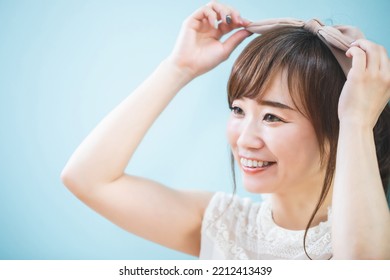 Asian Woman Getting Her Hair Done