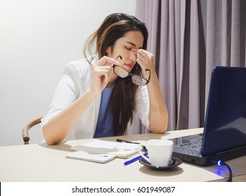 Asian Woman Got Headache From Working On Notebook All Day Long