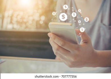 Asian woman hand using mobile phone with online transaction application, Concept financial technology (fintech) - Shutterstock ID 707777356