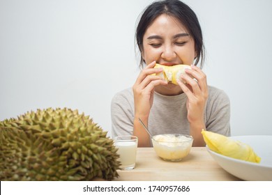 Asian Woman Happy Eating Durian With Ice Cream On The Table.