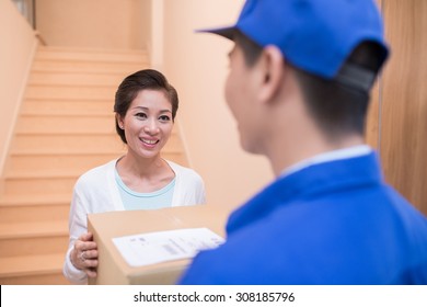 Asian Woman Is Happy To Receive A Parcel