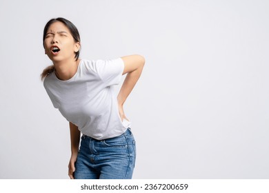 Asian woman has back pain, Symptoms of office syndrome. - Shutterstock ID 2367200659