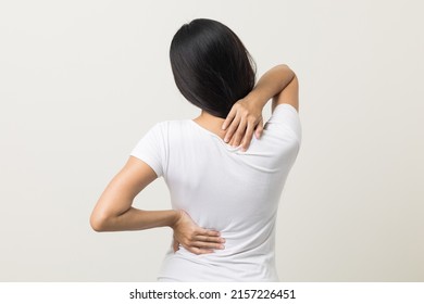 Asian woman has problem and structural posture She had neck   back pain  She massaged her neck   shoulders for relief  reduce muscle tension  Standing isolated white background