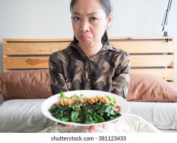 Asian Woman Hate Eating Kale Fried In Oyster Sauce.