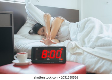 Asian Woman Hates Getting Stressed Waking Up Late 8 O'clock,Alarm Clock,Weekend Morning