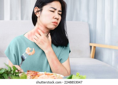 Asian woman have allergy reactions to shrimp or seafood have problems with rash, itching, and hives on the skin