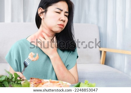 Asian woman have allergy reactions to shrimp or seafood have problems with rash, itching, and hives on the skin Foto d'archivio © 