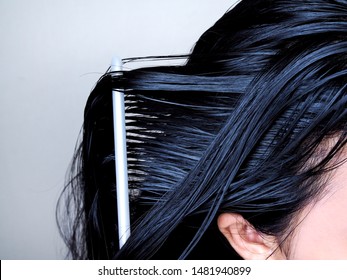 Asian Woman Have Black Hair Combing Long Hair With Comb. Hair And Scalp Health Care.