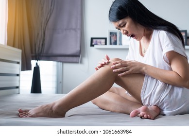 Asian Woman Having Accident Injury And Hurt A Knee Pain,Female Feeling Exhausted And Painful Kneecap,Emotional Face Expression