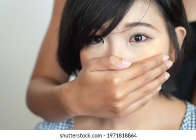 Asian Woman Having Her Mouth Covered, Concept Of Censorship, Free Speech Limitation, No Free Speech, No Freedom, Secret, News Manipulation, Hidden Truth, Press Freedom, Problem Cover Up