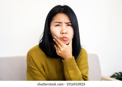 Asian Woman Having Problem With Bell's Palsy, Facial Palsy, Hand Holding Her Face