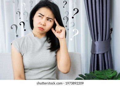 Asian Woman Having Problem With Obsessive-Compulsive Disorder, Forgetful And Alzheimer Concept With Question Mark In Her Mind 