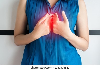 Asian Woman Having Or Symptomatic Acid Reflux,Gastroesophageal Reflux Or Gerd Disease,Because The Esophageal Sphincter That Separates The Esophagus And Stomach Dysfunction