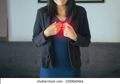 Asian Woman Having Or Symptomatic Reflux Acids,Gastroesophageal Reflux Disease,Because The Esophageal Sphincter That Separates The Esophagus And Stomach Dysfunction