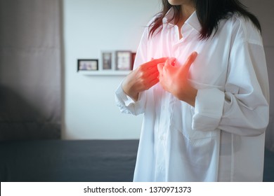 Asian Woman Having Or Symptomatic Reflux Acids,Gastroesophageal Reflux Disease,Because The Esophageal Sphincter That Separates The Esophagus And Stomach Dysfunction