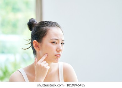 Asian woman having the trouble on her skin - Shutterstock ID 1819946435
