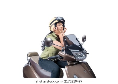 Asian Woman With A Helmet Sitting On A Scooter Isolated Over White Background