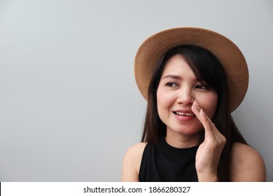 Asian Woman Hiding Mouth With Palm Whispering Gossips.