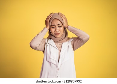 Asian Woman In Hijab Holding Head With Headache