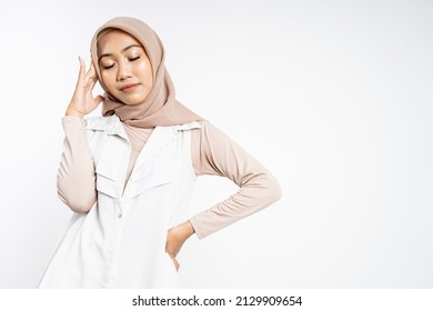 Asian Woman In Hijab Holding Head With Headache