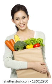 Asian Woman Holding Grocery Bag.