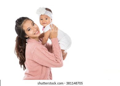 Asian Woman Holding Her Baby Girl Isolated Over White Background