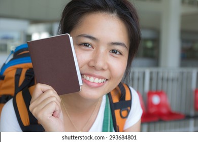 An Asian Woman Holding Passport Ready To Travel