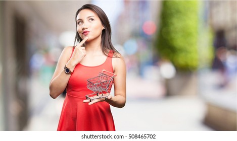 Asian Woman Holding A Shopping Cart