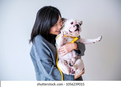 Asian Woman Hugging Dog