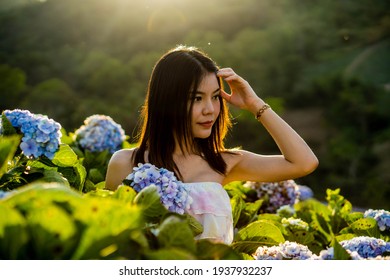 Asian Woman In A Hydrangea Garden Women And Flowers