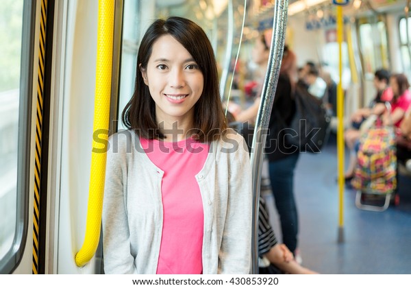 Asian woman inside train\
compartment
