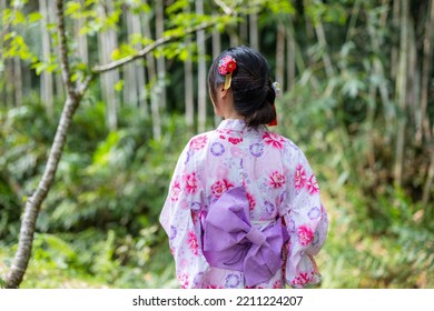 Asian Woman With Japanese Yukata In Countryside