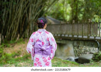 Asian Woman With Japanese Yukata In Countryside