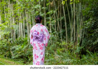 Asian Woman With Japanese Yukata In Countryside