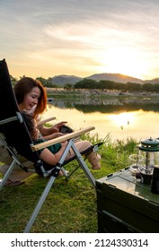 Asian Woman With Kid Travel And Camping At Natural Park. Family Outdoor Activity And Journey Lifestyle On Holiday.