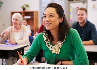 Asian Woman Looking At The Board In An Adult Education Class