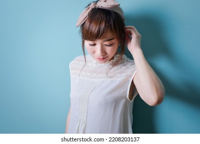 Asian Woman Looking Down (thinking,  Posing)