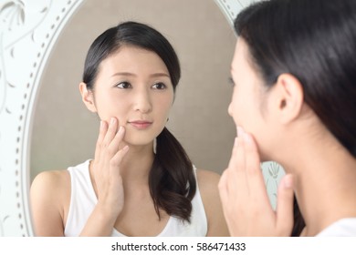 Asian Woman Looking Her Face Mirror Stock Photo (Edit Now) 586471061