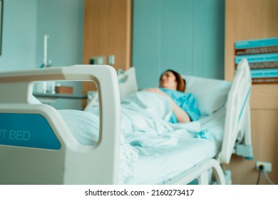 Asian Woman Lying Sick In Hospital.