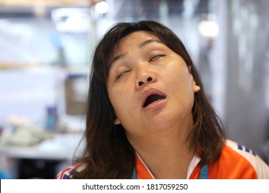 Asian Woman Make Funny Tired Face