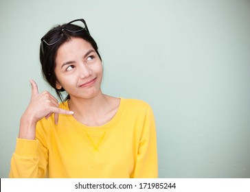 Asian Woman Making Call Me, Sign With Hand 