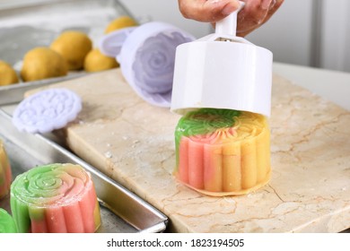 Asian Woman Is Making Colorful Snow Skin Moon Cake, Recipe Of Sweet Snowy Mooncake. Press Plastic Mould. Dessert For Mid-Autumn Festival, Close Up, Lifestyle.