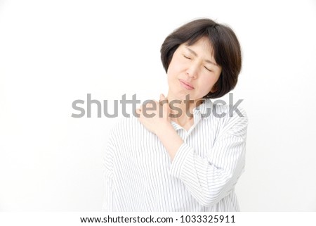 Asian Woman Massages The Senior Citizens Shoulders Asian Woman Massages The Senior Citizens Shoulders