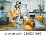 Asian woman moving things into new house smiling at her friends who are happily taking pictures. Concept of moving to a new house, home decorating and buying a new property.