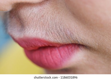 Asian woman mustache.Closeup.